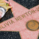Flowers are placed on Olivia Newton-John’s Hollywood Walk of Fame star on August 08, 2022 in Hollywood, California